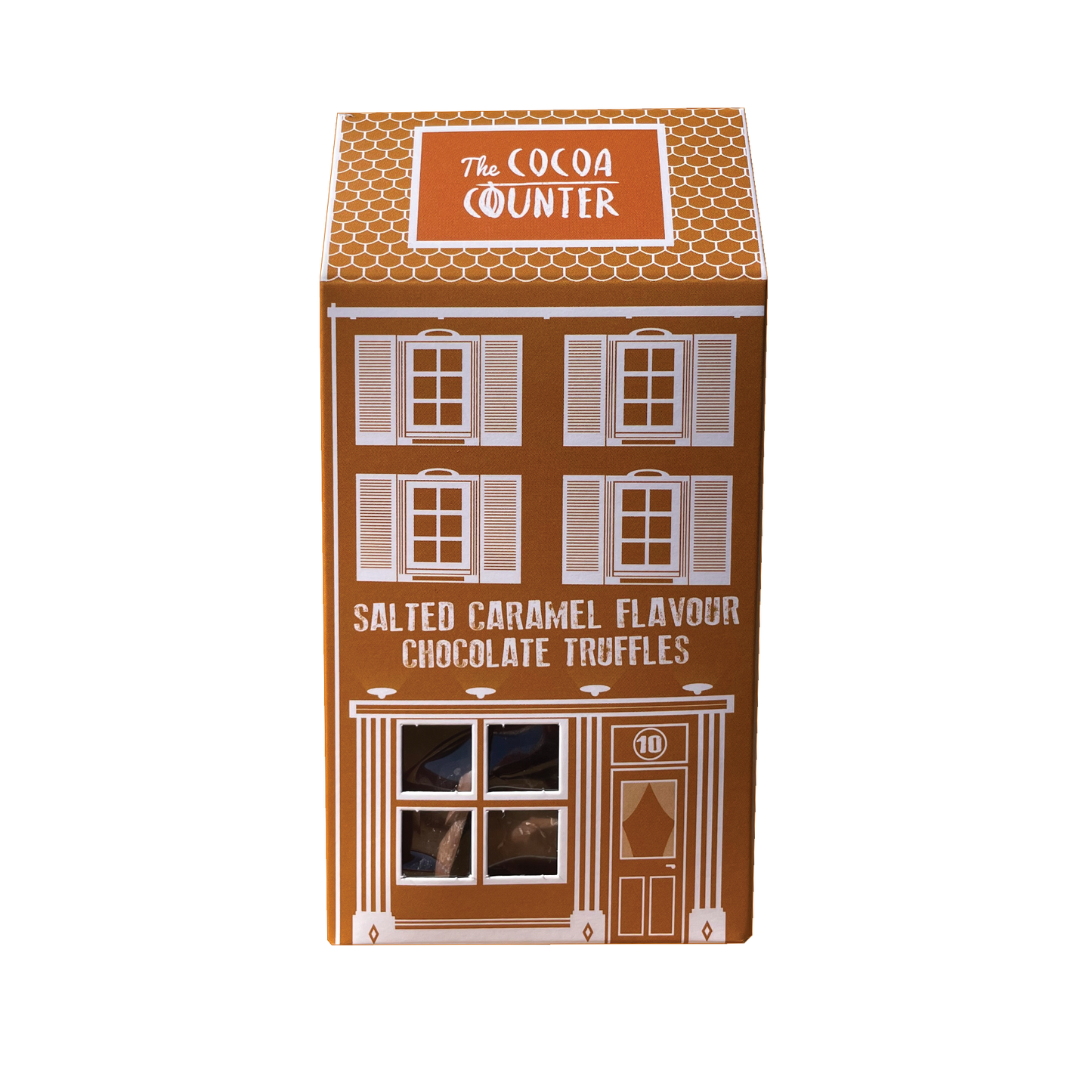 Salted Caramel truffles placed in a box shaped like a house.